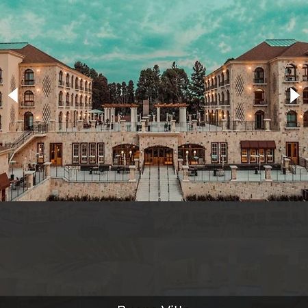 Buona Vitta Gramado Resort & Spa By Gramado Parks Экстерьер фото The photo shows a spacious and elegant building design, likely a hotel or resort. The structure features multiple stories and large windows, with outdoor seating areas visible on a terrace or patio. The exterior has a combination of stone and modern 